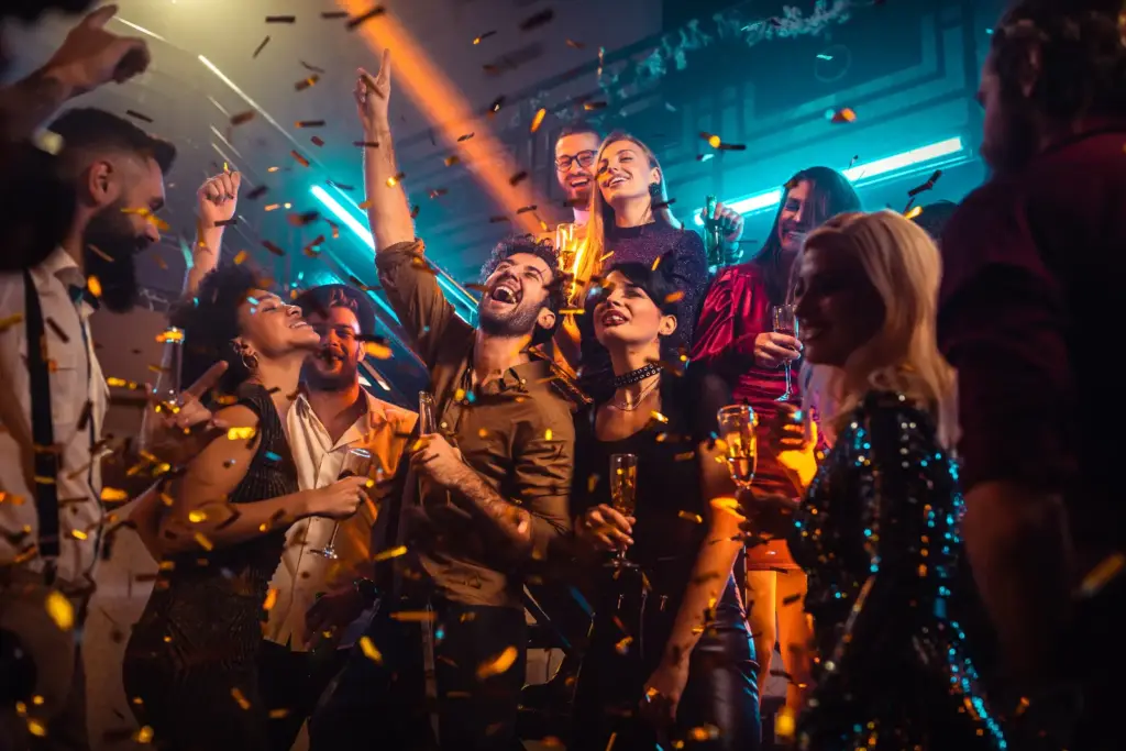 Group of energetic young people dancing at a party